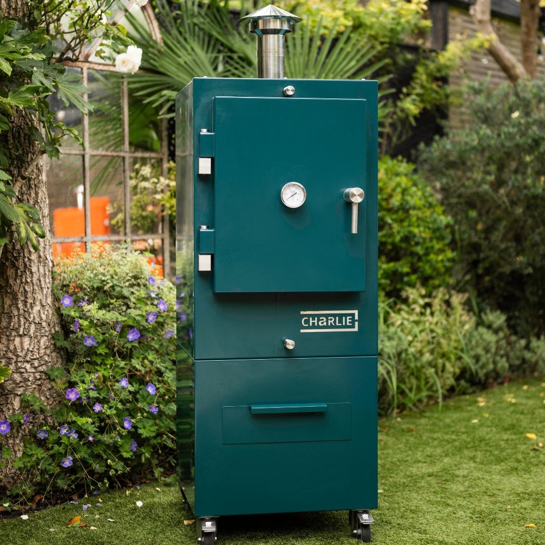 Charlie Charcoal Oven in Agave Green, garden lifestyle